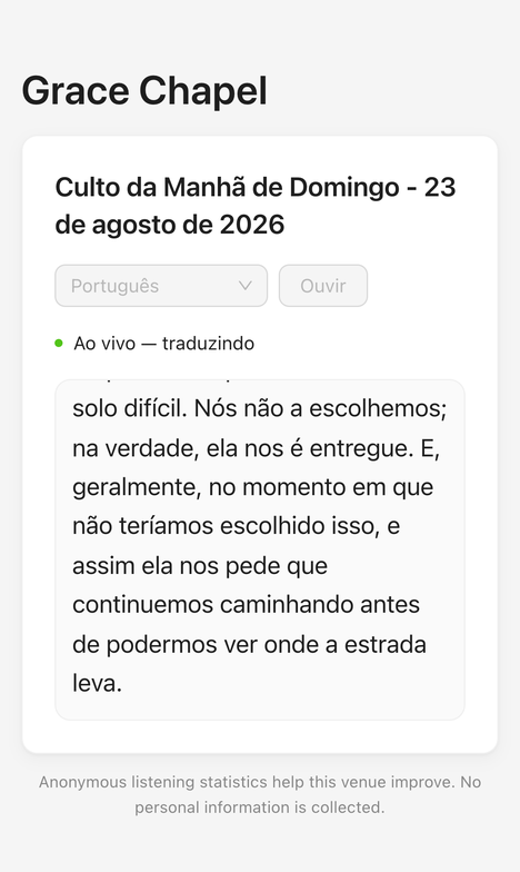 A phone showing the Portuguese translation of a service, with live captions.