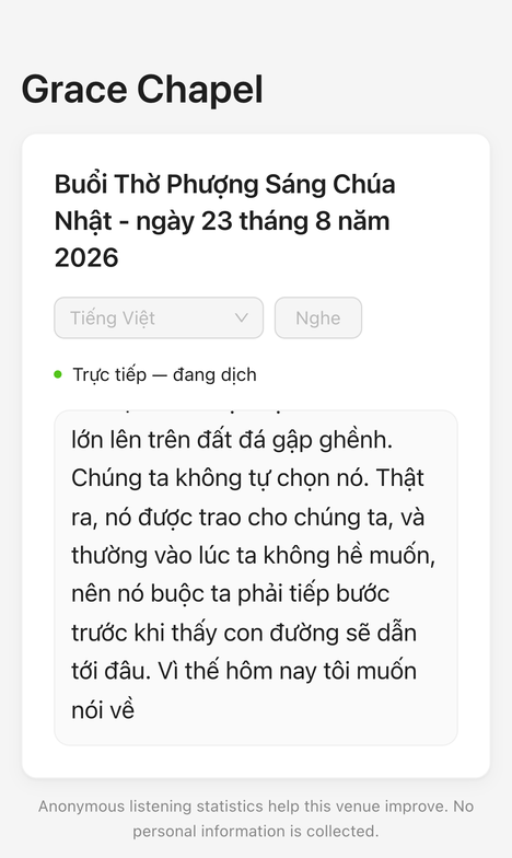 A phone showing the Vietnamese translation of a service, with live captions.